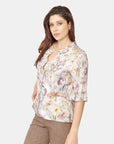 Blusa abierta con dealle de olán en el cuello Vitos