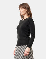 Blusa cuello redondo con bordado negro
