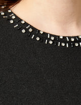 Blusa cuello redondo con bordado negro