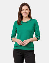 Blusa con detalle detalles tonos negros